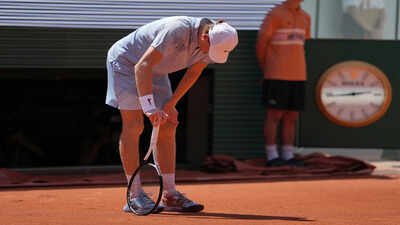 Jannik Sinner of Italy reacts as he plays against Juan Manuel Cerundolo of Argentina. (AP Photo) Jannik Sinner collapses in Paris heat, crashes out of French Open in stunning second-round shock