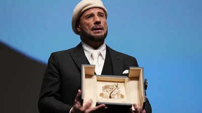 John Travolta tears up over honorary Palme d'Or  at Cannes Film Festival; makes directorial debut with 'Propeller One-Way Night Coach'