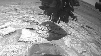 NASA’s Curiosity rover had a Martian rock stuck on its arm for days; here’s how it finally came off