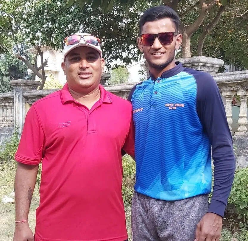 Urvil with his coach Prakash Patani