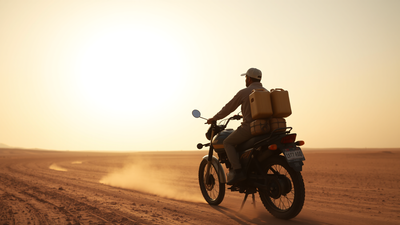 I traverse the sun-baked Balochistan desert, my motorbike laden with fuel, a silhouette against the immense, arid expanse. Between West Asia crisis and heatwave: Pakistan bikers risk lives to smuggle Iranian fuel
