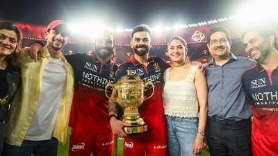 Royal Challengers Bengaluru's Virat Kohli, holding the trophy, poses for a picture with his wife, Anushka Sharma, and others after winning the Indian Premier League 2026 final (ANI Pic Service) Royal Challengers Bengaluru's Virat Kohli, holding the trophy, poses for a picture with his wife, Anushka Sharma, and others after winning the Indian Premier League 2026 final (ANI Pic Service)