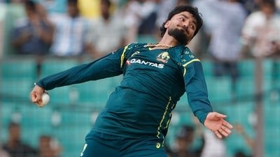 Australia's Nikhil Chaudhary bowls a delivery during the first T20 international cricket match between Australia and Bangladesh (AP Photo/Mosaraf Hossain) Australia's Nikhil Chaudhary bowls a delivery during the first T20 international cricket match between Australia and Bangladesh (AP Photo/Mosaraf Hossain)