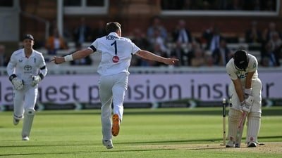 England's Ollie Robinson celebrates taking the wicket of New Zealand's Daryl Mitchell. (AFP)