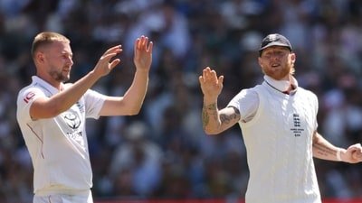 England's Gus Atkinson (L) with Ben Stokes during the Ashes Test match last December (AFP)