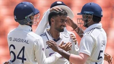India's Manav Suthar (C) is congratulated by teammates after taking his fifth wicket. (AP) India's Manav Suthar (C) is congratulated by teammates after taking his fifth wicket. (AP)
