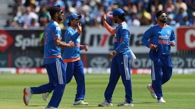 India's players celebrate the wicket of Ireland's Ross Adair during the second T20I in Belfast, Ireland, on Sunday. (Liam McBurney/PA via AP)