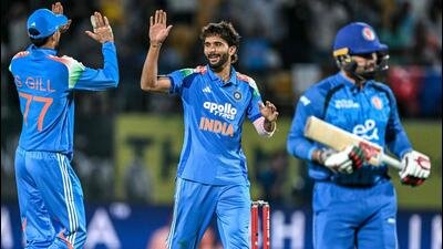 Nitish Kumar Reddy (C) celebrates the wicket of Afghanistan's Mohammad Nabi during the first ODI. (AFP)
