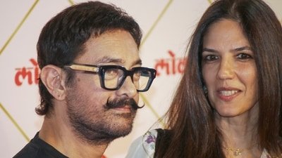 Mumbai: Bollywood actor and filmmaker Aamir Khan, left, with his partner, Gauri Spratt, poses for photographs during the 'Lokmat Maharashtrian of the Year Awards 2026', in Mumbai, Maharashtra, Tuesday, March 10, 2026. (PTI Photo) (PTI)