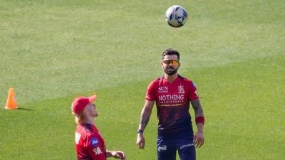 Virat Kohli warms up alongside Jordan Cox. (PTI)