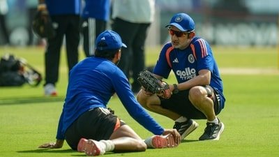 India's coach Gautam Gambhir, right, during a warm-up before the day three of a Test cricket match between India and Afghanistan, in Mullanpur (PTI)
