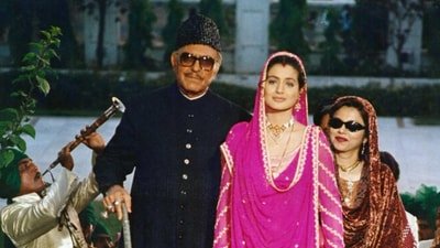 Ameesha Patel and Amrish Puri in a still from Gadar. Ameesha Patel and Amrish Puri in a still from Gadar.