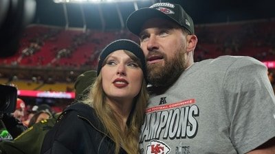 Kansas City Chiefs tight end Travis Kelce, right, is congratulated by Taylor Swift as they celebrate the Chiefs' victory over the Buffalo Bills in the AFC Championship NFL football game, Jan 26, 2025, in Kansas City. (AP Photo/Charlie Riedel)