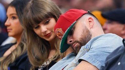 Travis Kelce (R) of the Kansas City Chiefs reacts as Singer Taylor Swift looks on during the fourth quarter in Game Three in the NBA Eastern Conference Finals at Rocket Arena on May 23, 2026 in Cleveland, Ohio. (Getty Images via AFP)