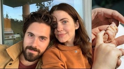 Julie Gonzalo and Chris McNally with the baby girl (Photo: People and X)