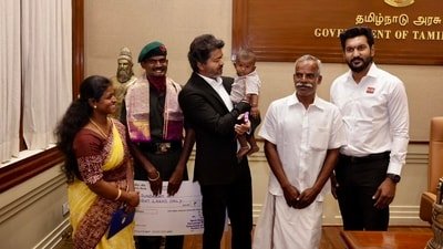 Tamil Nadu chief minister Vijay with Lance Naik Meenatchi Sundaram A and his family.
