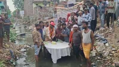 Watch: Agra BJP corporator cuts birthday cake in filthy drain to protest civic apathy