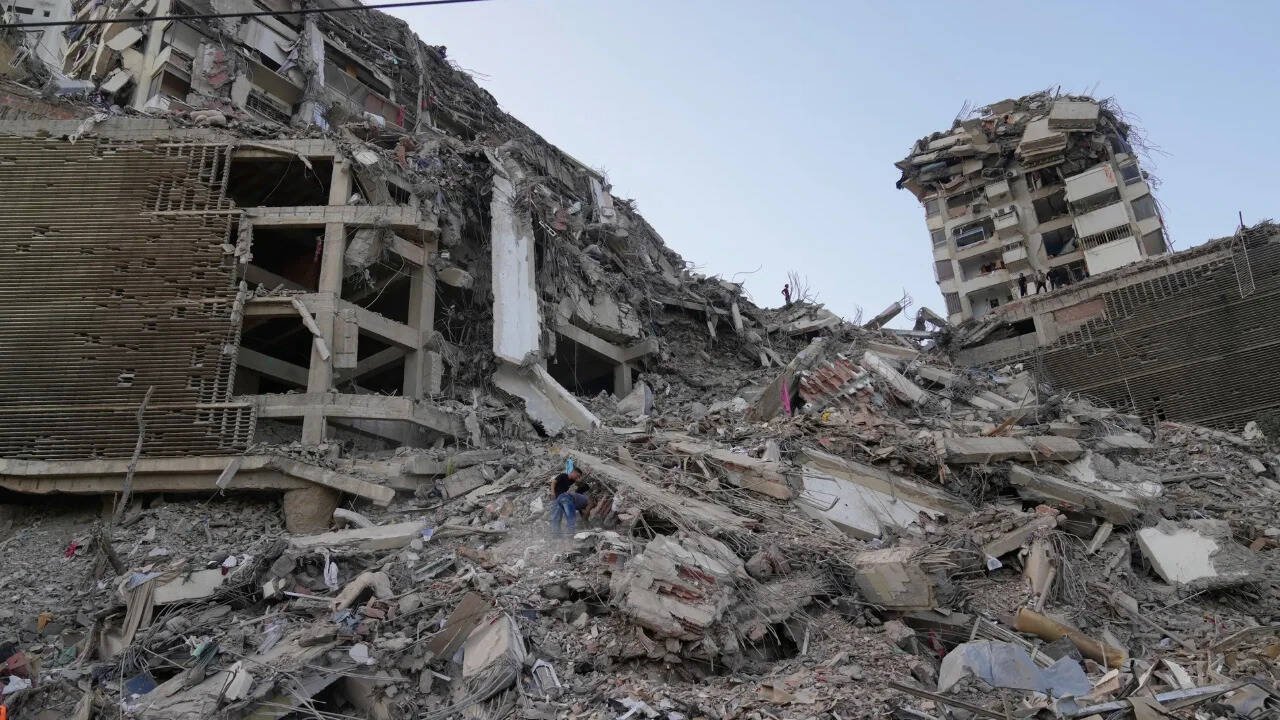 A massive pile of collapsed buildings and rubble marks the scale of destruction as rescue efforts continue across earthquake-ravaged Venezuela. Photo credit: AP