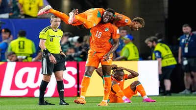 Ivory Coast's Ibrahim Sangare (18) carries teammate Amad Diallo (15) as they celebrate following their win. (AP Photo) Ivory Coast vs Ecuador FIFA World Cup Match Result: Amad Diallo's 90th-minute strike breaks Ecuador hearts in Ivory Coast's winning return