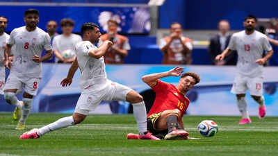Iran's Mehdi Taremi, left, and Belgium's Thomas Meunier fight for the ball (AP Photo) World Cup history! For the first time in the 21st century, Iran become...