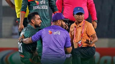Mehidy Hasan Miraz getting treatment after he was hit by a bouncer on the side of his helmet. (X Photo) Mehidy Hasan Miraz rushed to hospital after heroic knock seals Bangladesh's historic series win over Australia