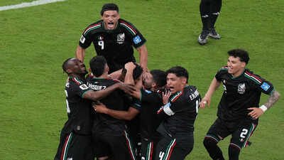 Players celebrate after Mexico's Luis Romo, bottom middle, scored the goal. (AP Photo) Mexico vs South Korea, FIFA World Cup Match Result: Mexico become first team to reach Round of 32 after Romo strike sinks South Korea