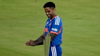 India's captain Suryakumar Yadav poses with the 2026 ICC Men's T20 Cricket World Cup trophy (AFP)