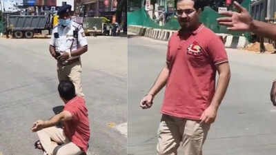Man sits on road as pregnant wife 'trapped' in traffic jam after VIP convoy stops vehicles in Bengaluru