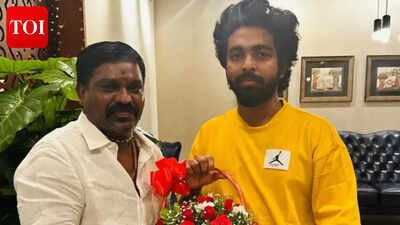 Velmurugan gifts gold chain to GV Prakash engraved with the words '100 Films GV Sir' to celebrate his 100-film milestone