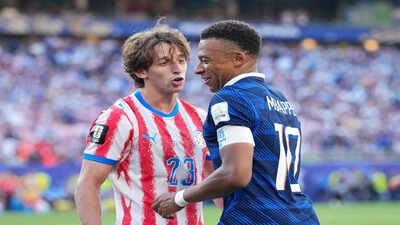 Paraguay's Matias Galarza (23) talks with France's Kylian Mbappe (10) (AP Photo/Martin Meissner) 'Paraguay's players were absolute disgrace': South American side slammed after FIFA World Cup exit to France