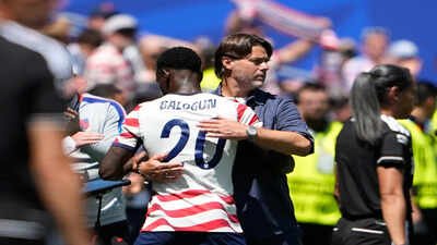 United States head coach Mauricio Pochettino embraces United States' Folarin Balogun. (AP Photo) Trump thanks FIFA as USA coach Pochettino hails Balogun red-card reprieve: 'Everyone should celebrate'