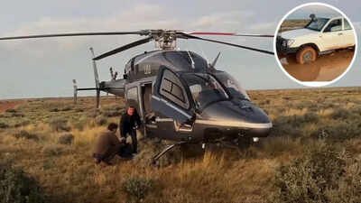 Stranded for 12 hours with no signal and fading hope, a father and son were rescued from one of Australia’s most remote corners by a billionaire Australian father and son were stranded in the outback for 12 hours after a storm trapped their car; billionaire Tim Roberts, who happened to be flying his helicopter, rescued them