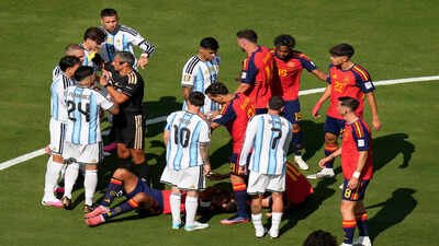 Referee Slavko Vincic of Slovenia shows yellow card to Argentina's Leandro Paredes (AP Photo) 'Total disgrace': Argentina branded 'classless' as post-final conduct sparks outrage