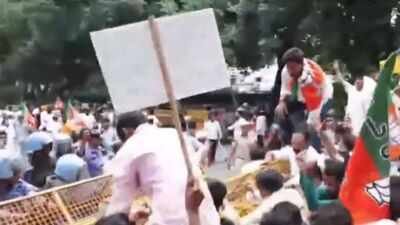 BJP workers clash with police outside AAP office (ANI Photo) BJP workers clash with police outside AAP office, demand Punjab education minister's resignation