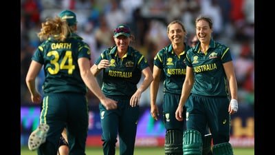 Australia players celebrate after beating England in the ICC Women's T20 World Cup at Lord’s on Sunday. (Reuters)