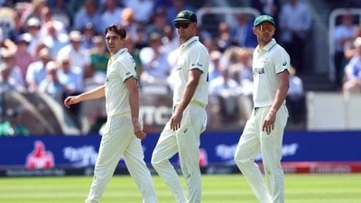 Pat Cummins walks back to the Lord's Pavilion with Josh Hazlewood. (Action Images via Reuters)