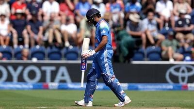 India’s Rohit Sharma walks off the pitch after being caught out by England's Jos Buttler during the second ODI. (AP)