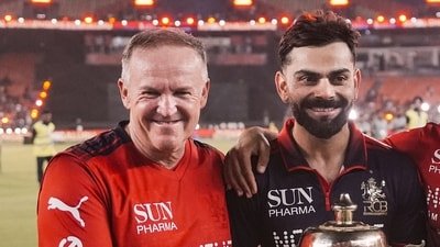 Royal Challengers Bengaluru's Head Coach Andy Flower and Virat Kohli hold the trophy after winning the Indian Premier League (IPL) 2026 title (PTI)
