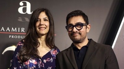 Mumbai: Bollywood actor Aamir Khan, right, with his partner Gauri Spratt, during a celebration marking 25 years of Aamir Khan Productions, in Mumbai, Maharashtra, late Saturday, June 13, 2026. (PTI Photo) (PTI) Mumbai: Bollywood actor Aamir Khan, right, with his partner Gauri Spratt, during a celebration marking 25 years of Aamir Khan Productions, in Mumbai, Maharashtra, late Saturday, June 13, 2026. (PTI Photo) (PTI)