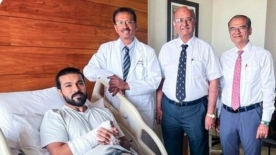 Ram Charan smiles from hospital bed after surgery; fans wish him speedy recovery.