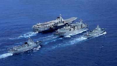 A Type 901 replenishment ship, center, together with the aircraft carrier Liaoning, at top, and escorting surface combatants China building world's largest naval replenishment ship to boost carrier operations