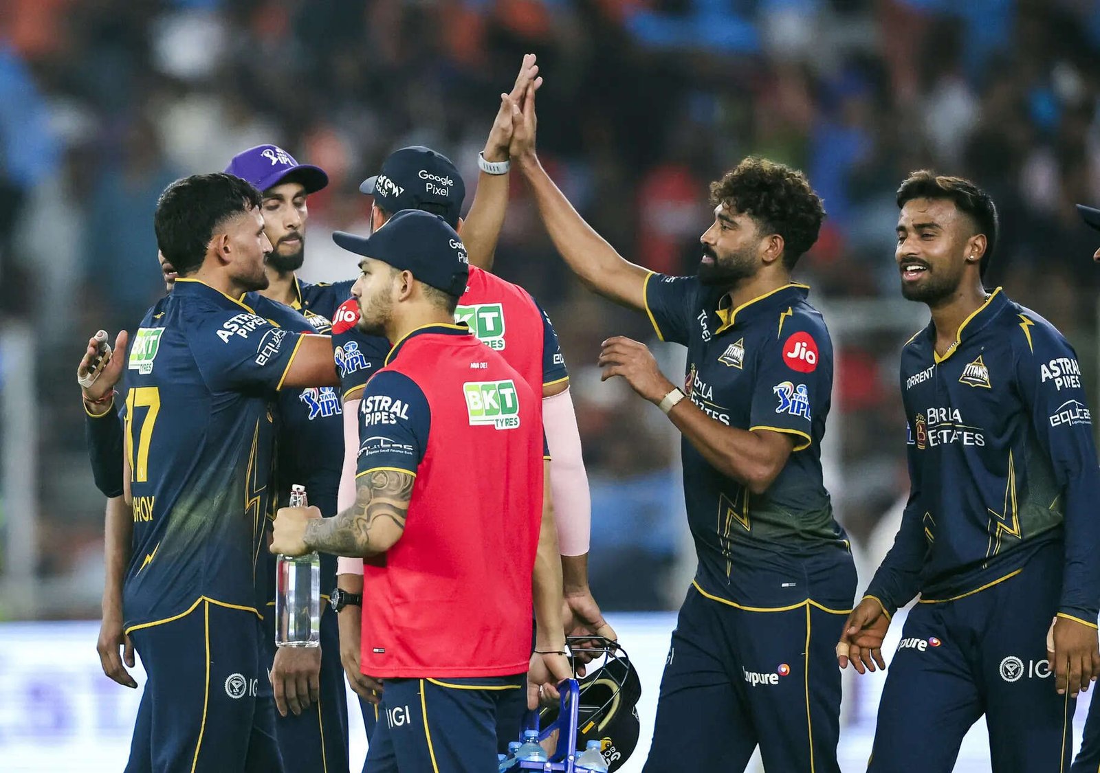 Ahmedabad, Apr 17 (ANI): Gujarat Titans' Ashok Sharma and teammate celebrates th...