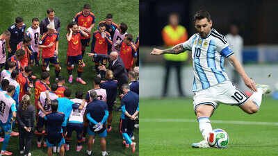 Spain team; and Lionel Messi (AP Photos) 'Shutting down Messi is impossible': Andres Iniesta reveals what Spain must do against Argentina in World Cup final