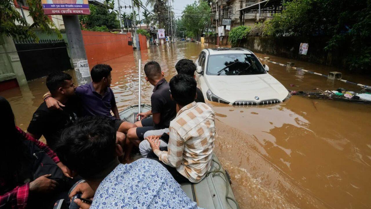 Car submerged in floods (AP Photo)