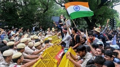 Activists and supporters of the Cockroach Janta Party (CJP) clash with police personnel during a protest demanding the resignation of India's Education Minister Dharmendra Pradhan over alleged NEET examination irregularities in New Delhi. (AFP) Activists and supporters of the Cockroach Janta Party (CJP) clash with police personnel during a protest demanding the resignation of India's Education Minister Dharmendra Pradhan over alleged NEET examination irregularities in New Delhi. (AFP)