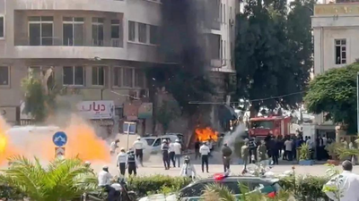 Smoke and fire rise at the site where explosive devices blew up near a hotel where Macron was meant to be staying, in Damascus, Syria Watch: Explosions near Macron's Damascus hotel as French leader meets Syria's president