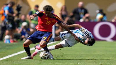 Argentina's Nicolas Tagliafico, right, fights for the ball with Spain's Lamine Yamal. (AP/PTI Photo) No card for Tagliafico! Yamal challenge reignites Argentina favouritism debate in World Cup final - Watch