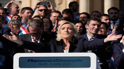 French far-right leader Marine Le Pen delivers her speech during the French far-right party national rally near the parliament in Paris, Sunday, April 6, 2025. (AP Photo) France's Marine Le Pen sentenced to house arrest, 2027 presidential bid remains uncertain