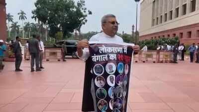 Kalyan Banerjee stage a protest at Parliament (PTI) '20 traitors of Bengal': TMC's Kalyan Banerjee wears poster with rebel MPs' photos in Parl, seeks swift ECI decision