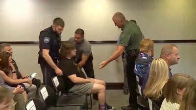 A high school Physics teacher left the Kansas city council meeting on voting for datacenter in handcuffs, dragged out by police after clapping at …